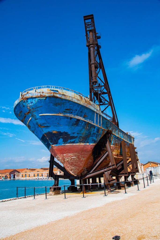 Brown Wooden Boat on Sea Shore